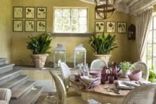a Provence dining space with yellow walls and a whitewashed ceiling, a refined vintage table and vintage chairs, a gallery wall
