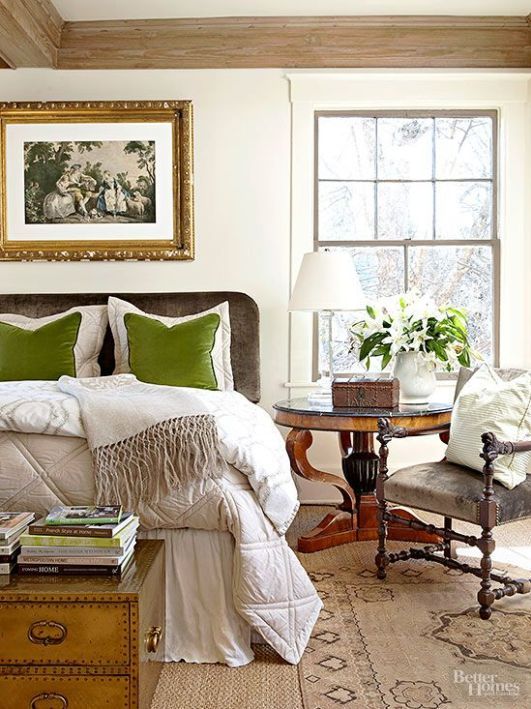 a neutral fall bedroom done in beige and creamy plus some touches of green and natural wood
