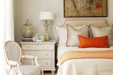 a refined fall bedroom done in creamy, grey, touches of rust and green for a fall feel