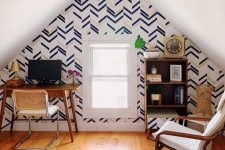 a cozy home office with chevron wall decor