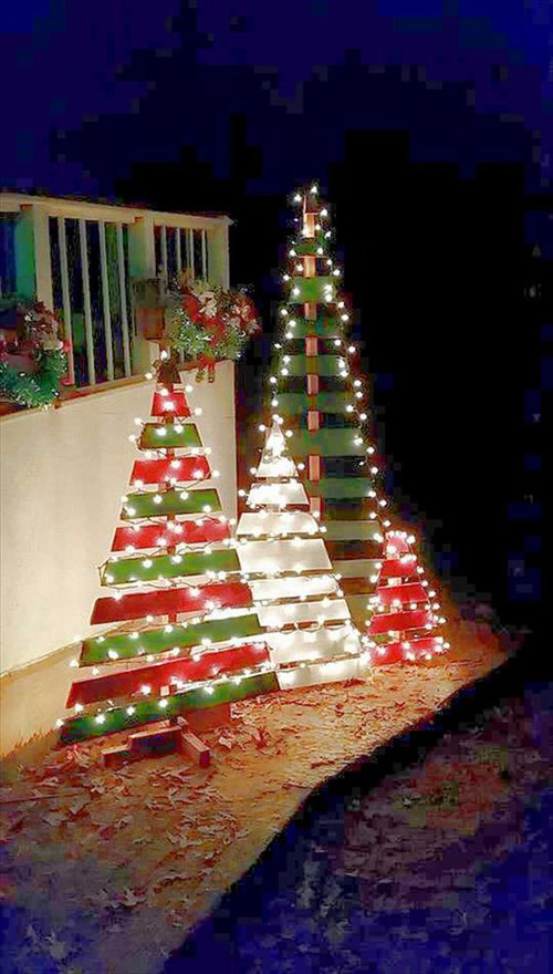 A bunch of scrap wood pieces painted in green and red are more than enough to make beautiful Christmas tree alternatives. Just add some LED lights on them.