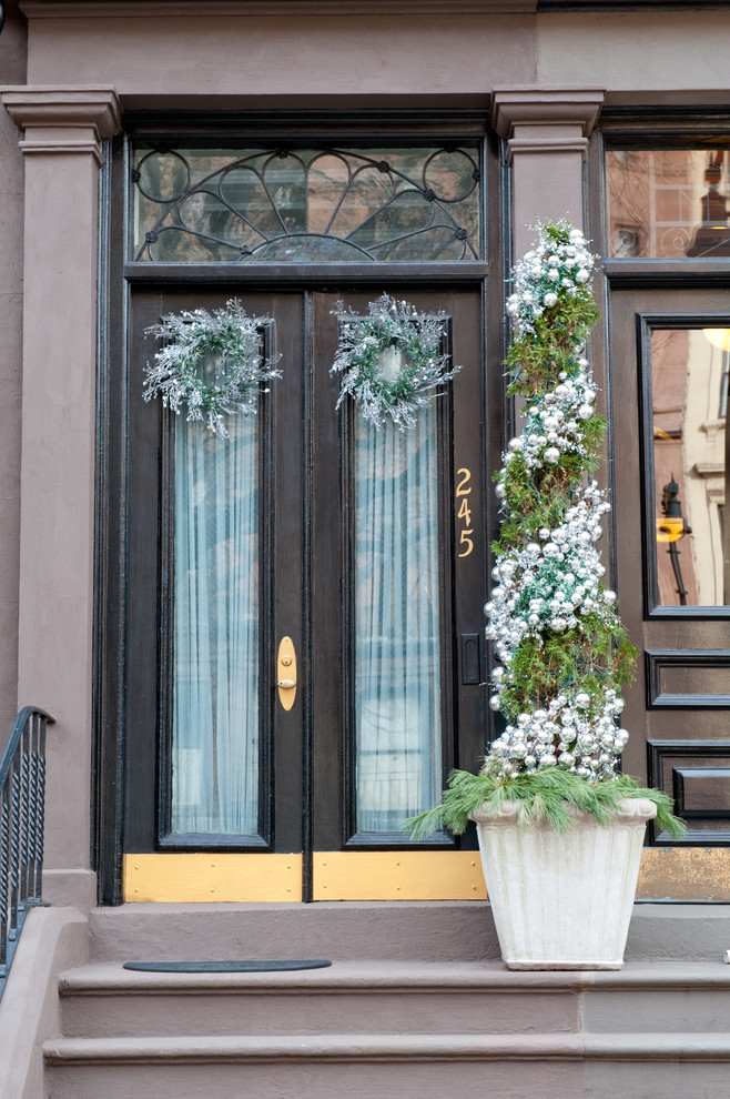 Add some ornaments to your entryway's topiary and you're ready for holidays!