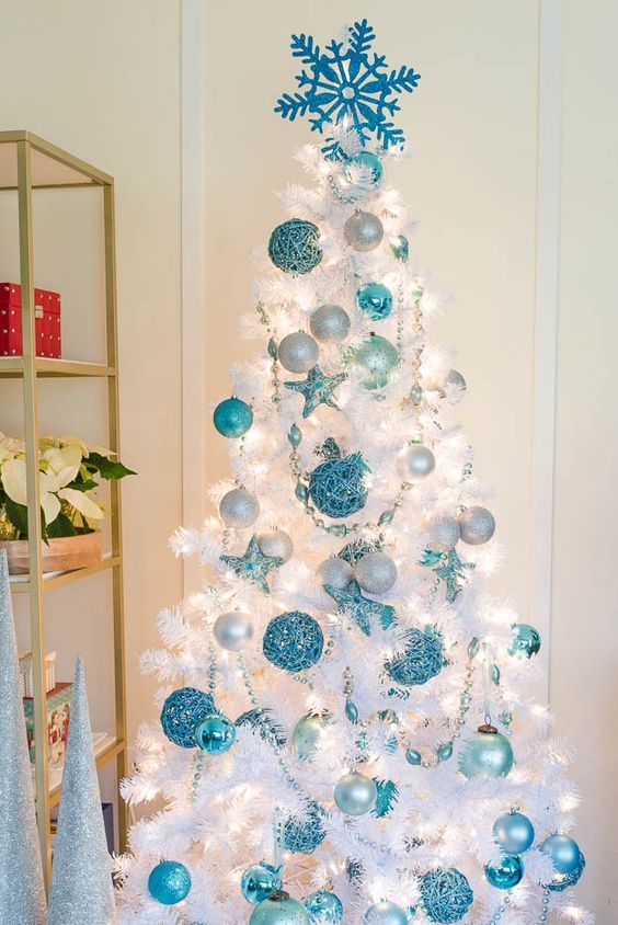 a pure white Christmas tree looks amazing with blue ornaments of various shades