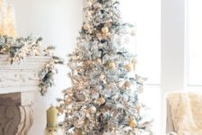 a silver tree with a snowflake topper pastel and yellow ornaments looks refined