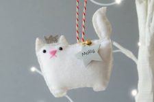 a white princess cat ornament of felt, with a bell and a star is a gorgeous personalize idea for Christmas