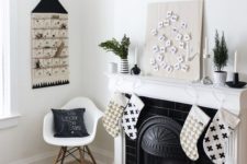 black and white stockings, black garlands, an advent calendar and black and white pillows