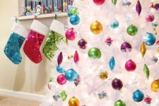 if you love bold colors, rock a pure white tree with bold ornaments to accentuate them