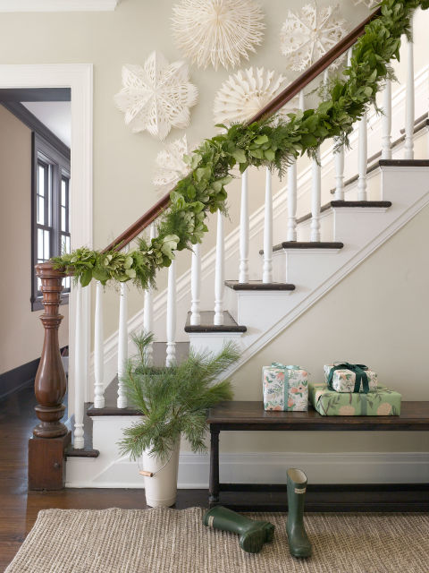 Garland that incorporates fresh asparagus ferns and evergreen shrubs is an interesting alternative to standard pine swags.