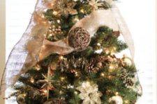 rustic Christmas tree styling with lights, gold ornaments, pinecones, vine balls, burlap ribbons and bows