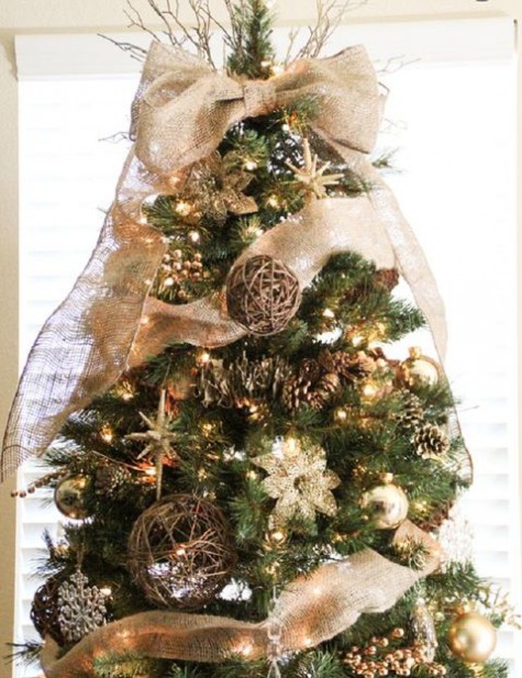 rustic Christmas tree styling with lights, gold ornaments, pinecones, vine balls, burlap ribbons and bows