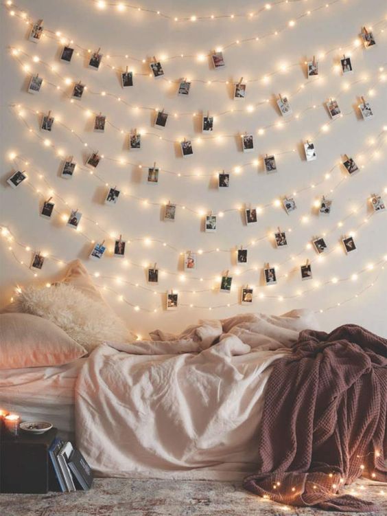 string lights and Polaroids hanging on them for an ambience and a cute look