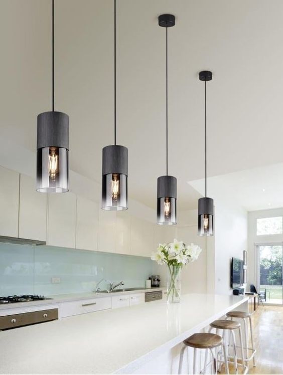 Ultra modern black pendant lamps with smoked glass will give your space an edgy feel and will make it wow