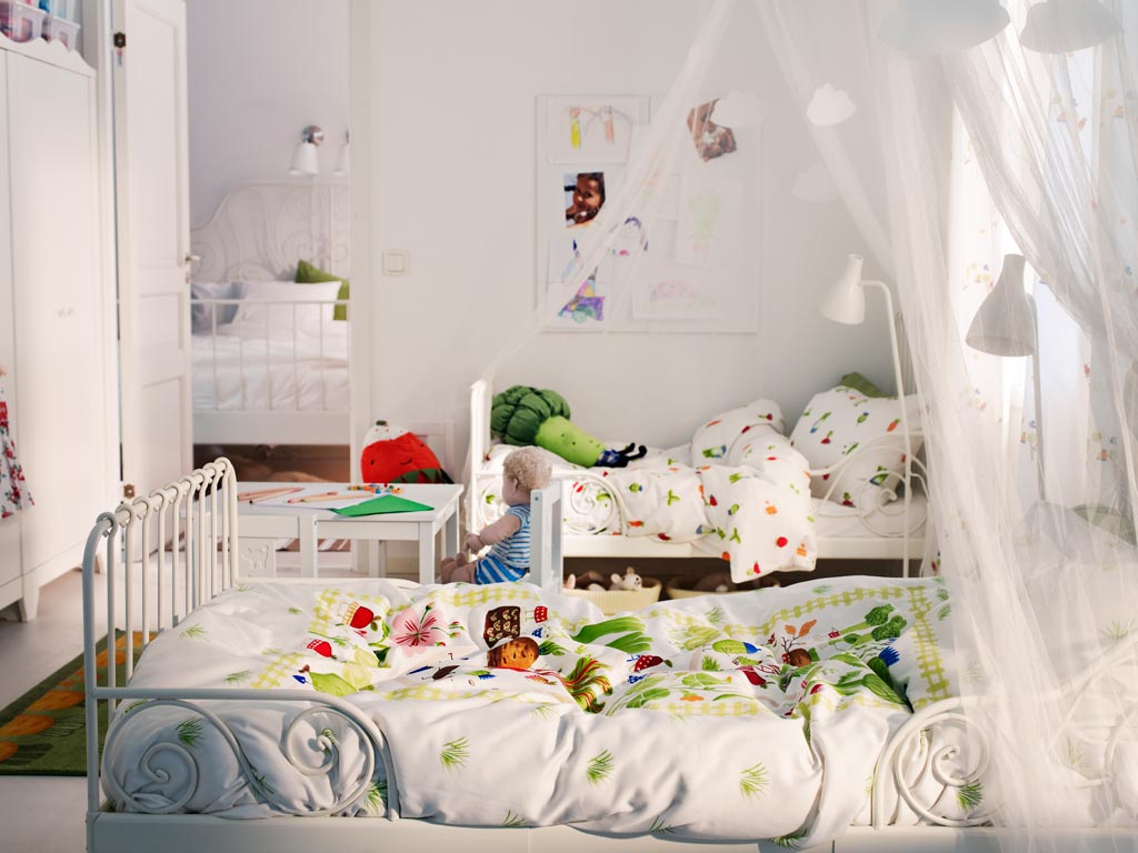 All-White shared kids bedroom located right next to the master bedroom. Canopies make the room looks really cozy.