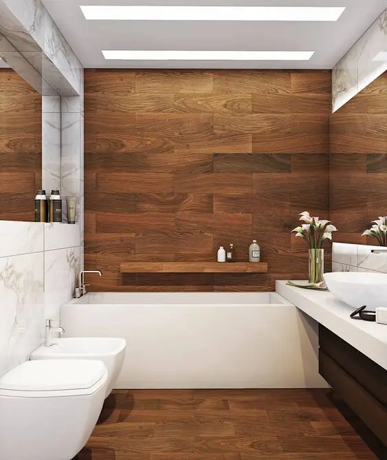 a contemporary bathroom clad with rich stained wood, with a black vanity, white appliances and skylights is very chic