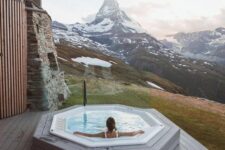 a hexagon-shaped built-in jacuzzi with a fantastic view of the snowy mountains is an amazing space to enjoy the views and relax