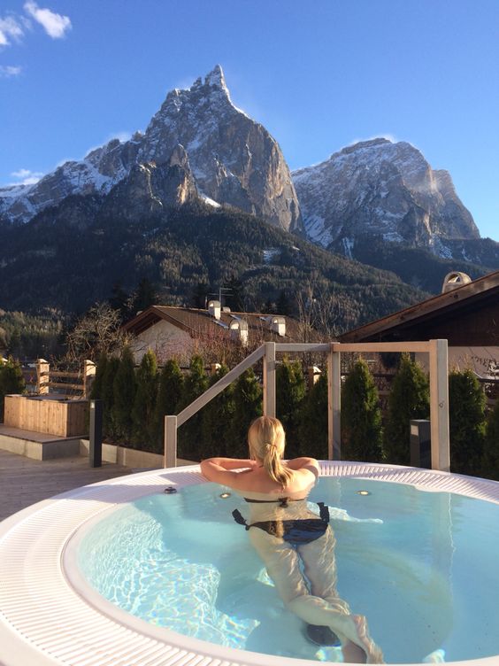 a jacuzzi with a deck and a jaw-dropping mountain view is amazing, you can enjoy the hot water and the views