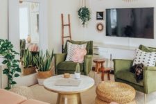 a sweet green and pink living room with potted greenery, jute ottomans, touches of gold and artworks