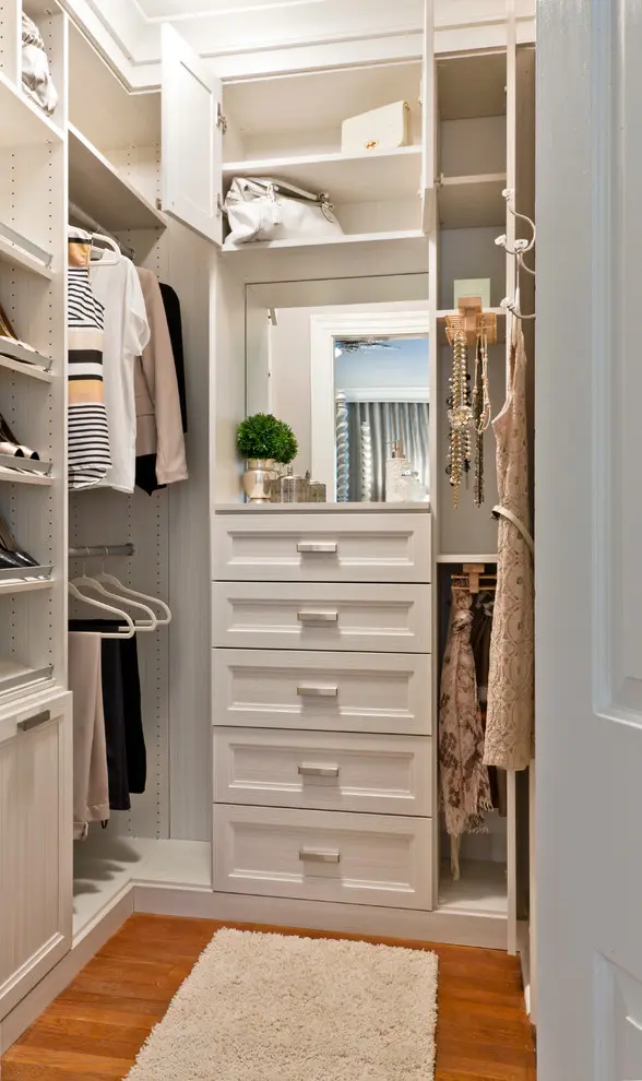 Pull-outs, valet rods, hooks, shelves and even a vanity area could be fit in a quite compact space. Just make sure to occupy all walls with storage from floors to a ceiling.