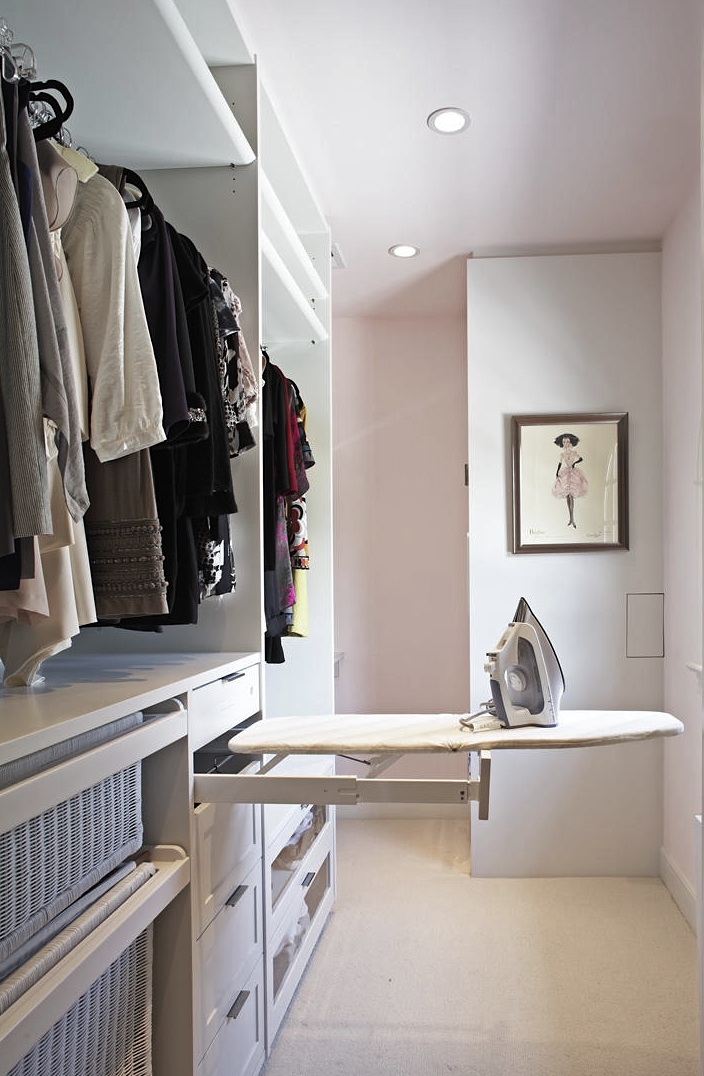 Pullout ironing board is an ideal space saving solution for small walk-ins.