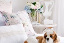 a floral pillow and soem pastel bloms in a vase are all you need for a slight elegant spring touch