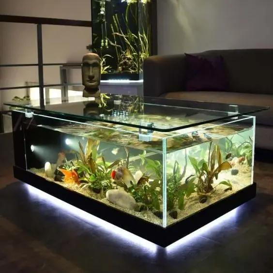 a lit up aquarium as a large coffee table is a statement decor idea that will turn you room into a unique one