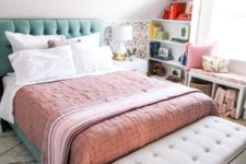 a mint grene upholstered bed, peahcy pink bedding and a floral half wall for a spring feel in the room