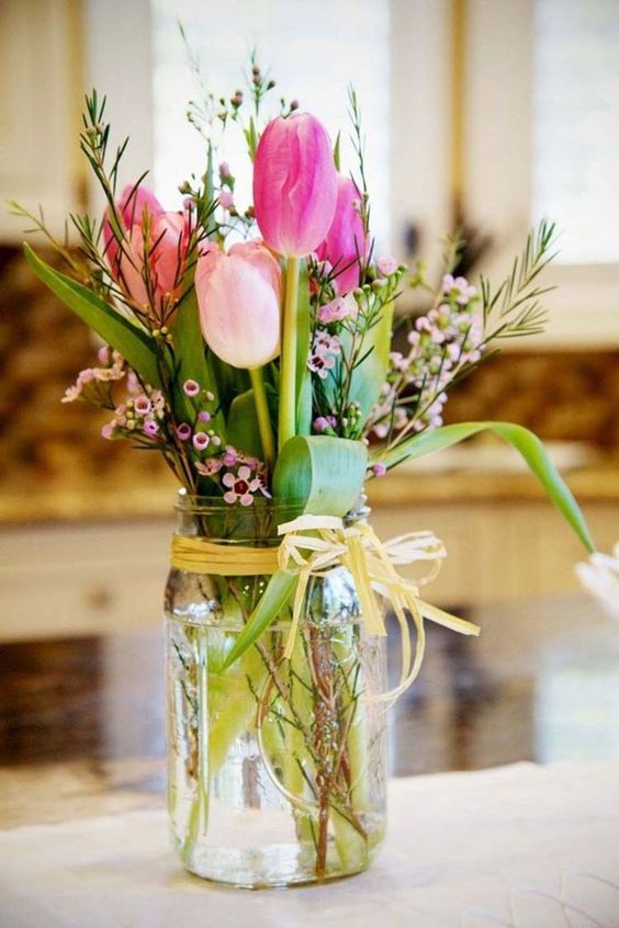 a simple flower arrangement in pink and green in a jar is a cool idea that you may make yourself very fast