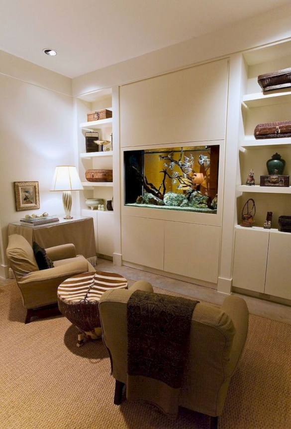 an eclectic neutral living room with a vuilt-in fish tank instead of a TV is a very natural and cozy idea