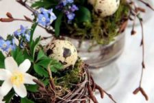nests with moss, blue and white blooms and faux speckled eggs is a cool idea