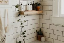 place some greenery in pots on the open shelves to make your neutral bathroom feel and look very fresh