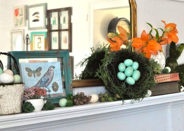 simple Easter mantel with faux eggs, a fake nest, some bird pictures and moss