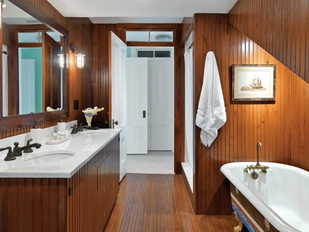 Dark wood is a great material if you're looking for not too modern bathroom's look.