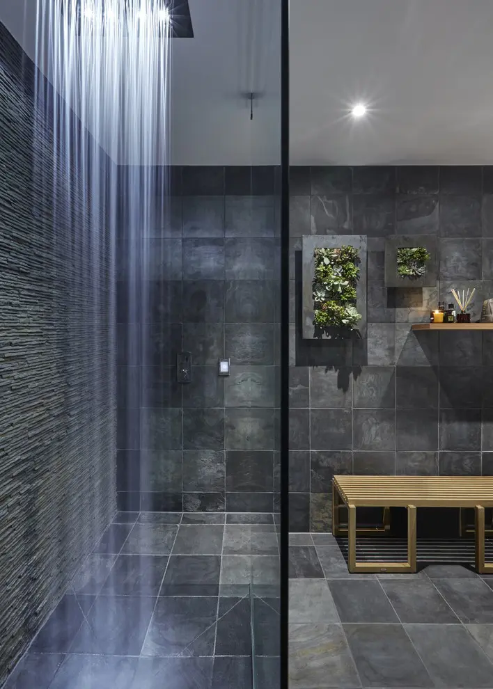 Dark wall-to-wall slate tiles are great but living wall foliage could make the bathroom's design truly impressive.