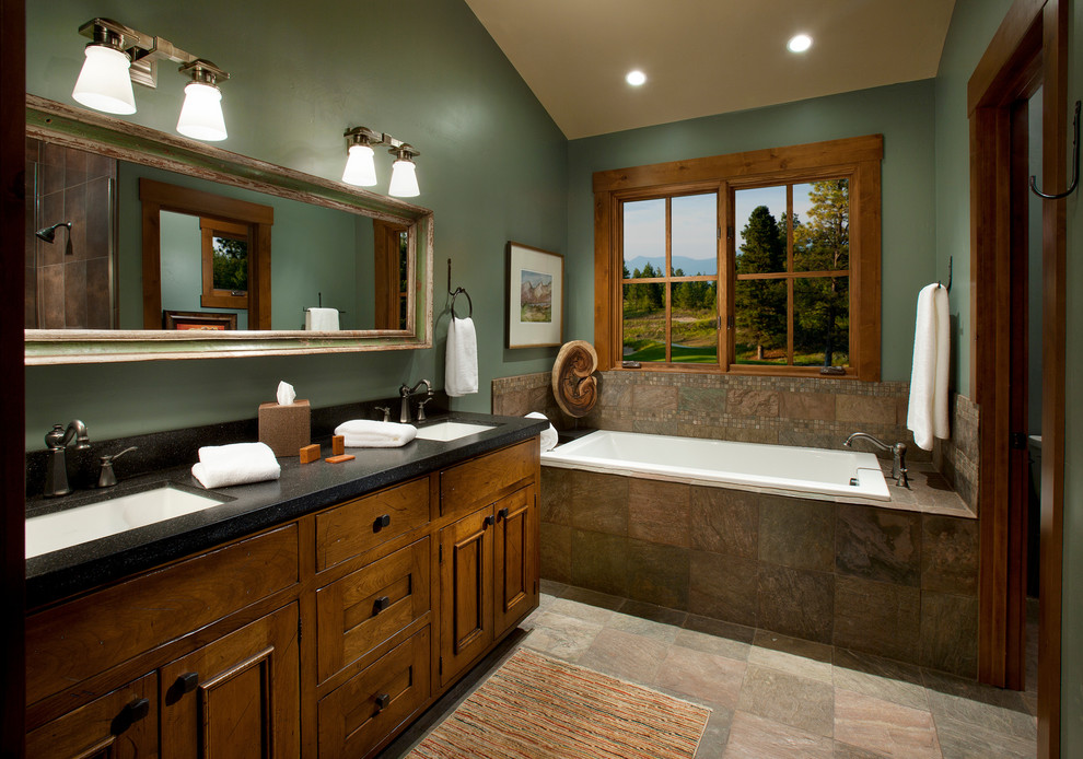 Deep green and relatively dark wood is a great alternative to black and grey color schemes men often choose.