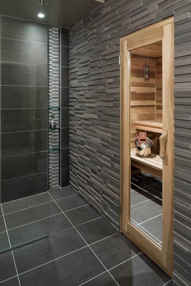 What could be more masculine than a super dark bathroom with a door to a wooden sauna? Nothing!