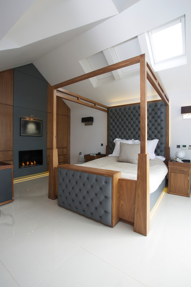 a fireplace and an unqiue wooden bed make this bedroom quite amazing