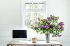 floral branches in a metal vase will bring a spring and a rustic feel to the home office or any other space