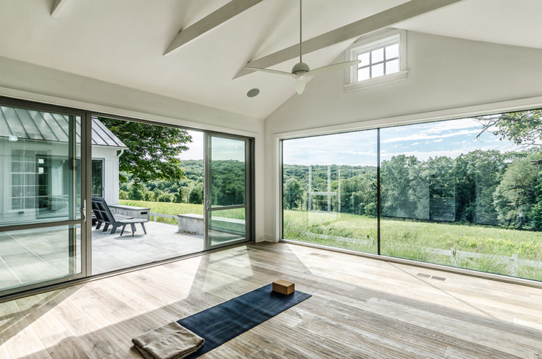 a minimalist glazed meditation space with a mat feels very airy and light-filled  (Blansfield Builders, Inc.)
