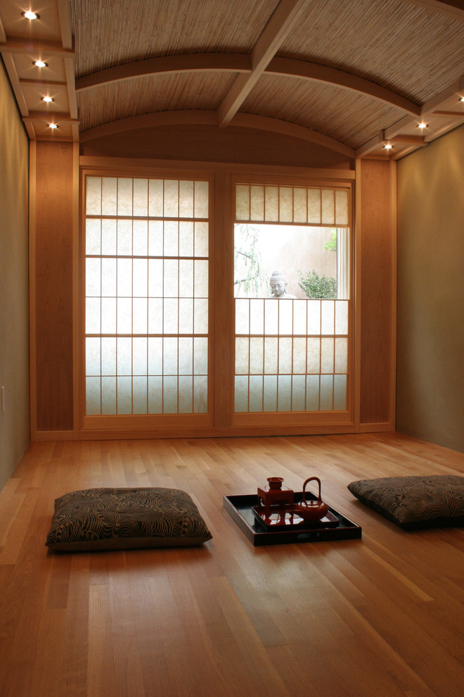 an Asian-inspired meditation room with pillows and lights  (Design A)