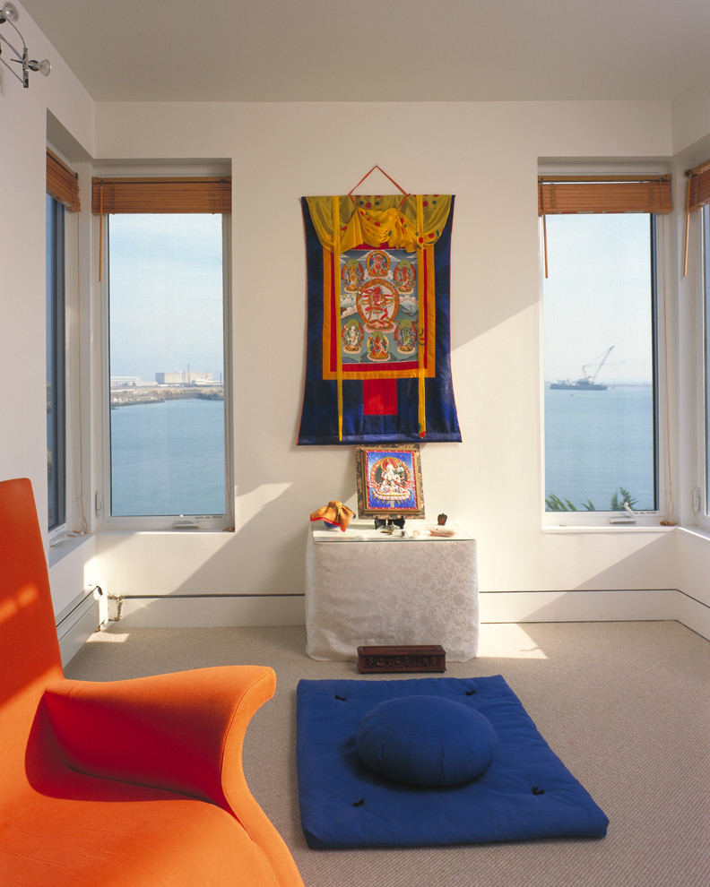a colorful yet minimalist meditation space in orange and blue plus sea views (DNM Architecture)