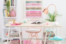 a bright feminine home office with a striped artwork, a colorful rug, a blue flamingo and touches of copper here and there