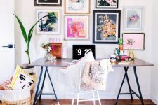 a colorful and fun girlish home office with a comfy desk, a bright gallery wall, a basket with pillows and a fur rug