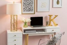 a glam feminine home office with a blush accent wall, white furniture, a glam gallery wall and lots of gold