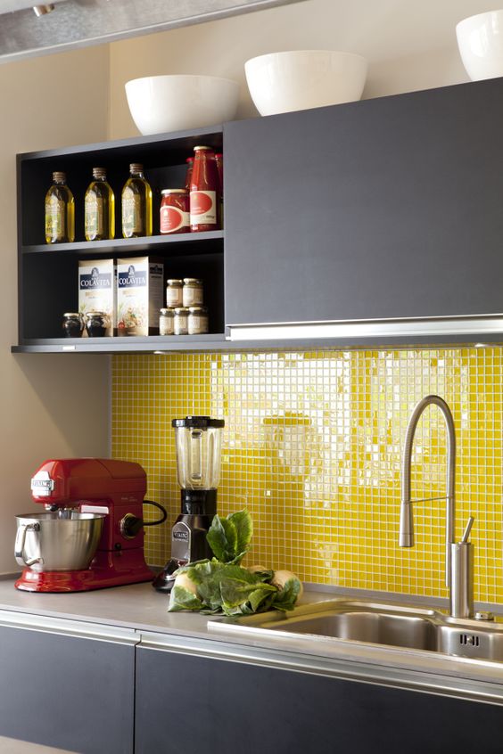 a sleek grey modern kitchen with grey countertops and a bold yellow small tile backsplash is a very cool and fresh idea