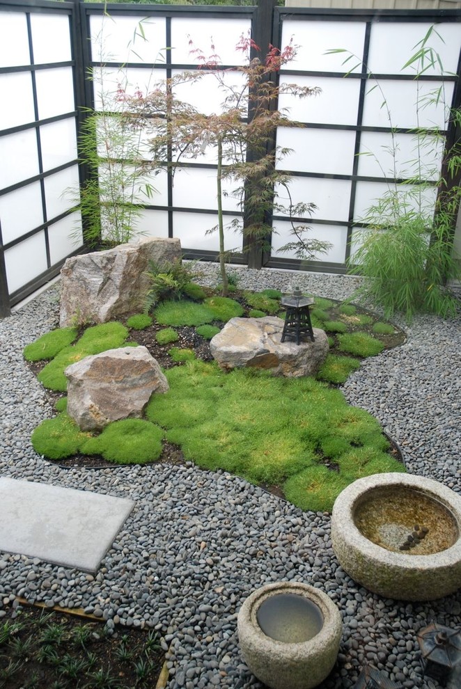 Courtyard is a perfect place for a little rock garden because it's easier to create low-maintenence conditions there.