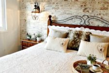 a cozy rustic space with a fake whitewashed brick wall and rich stained furniture that contrasts it