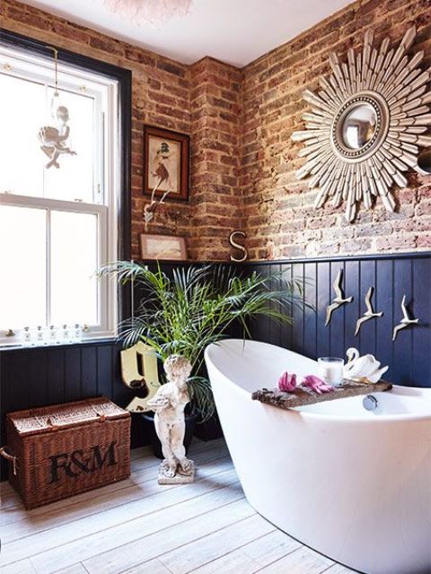 red brick and navy paneling walls create a bold and contrasting combo that makes the space chic