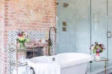 red brick highlights the fireplace and makes the bathroom look very vintage-like and very refined