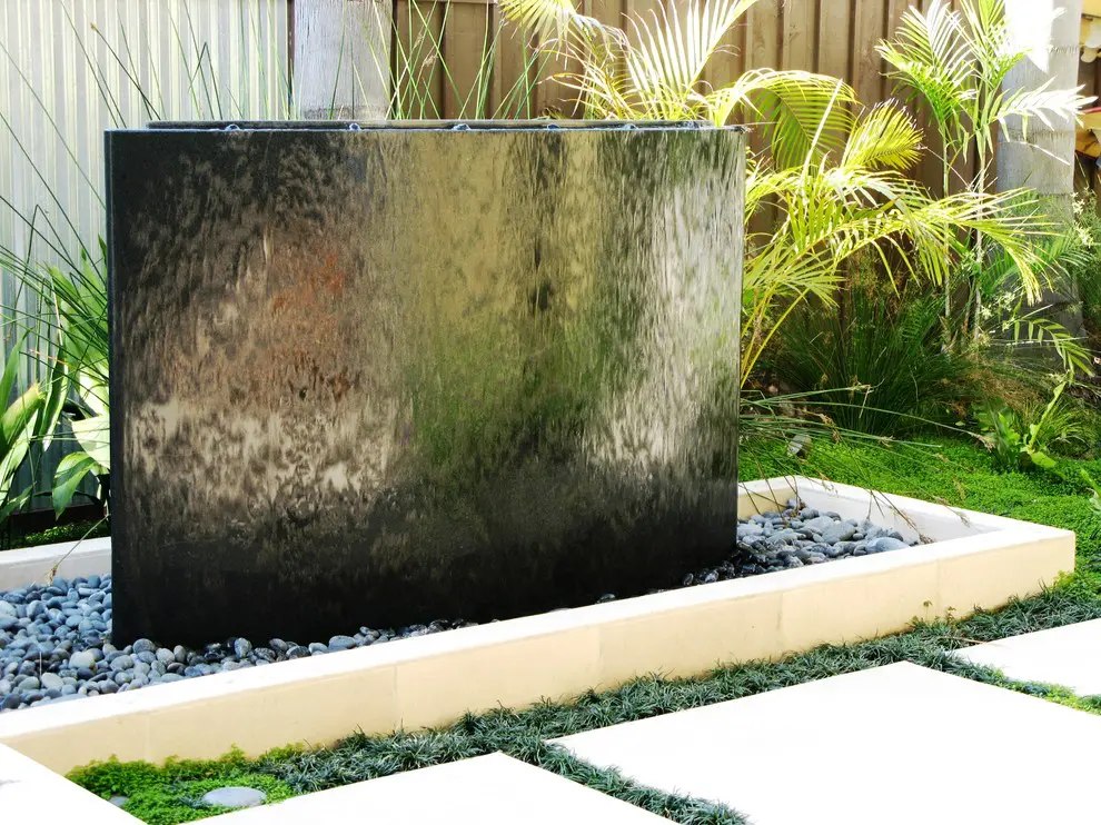 Pebbles are often chosen to fill the base of water walls.