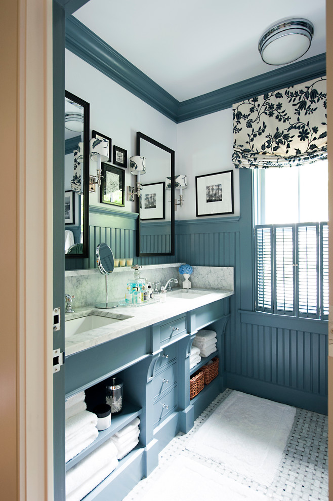 a blue and white farmhouse bathroom features a shade of blue inspired by the ocean  (ColeBuilt)
